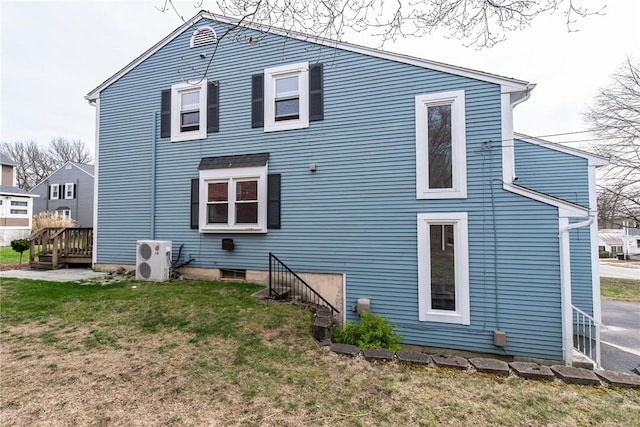 83 Wyndham Ave, Providence, RI 02908 - back of property with ac unit and a yard