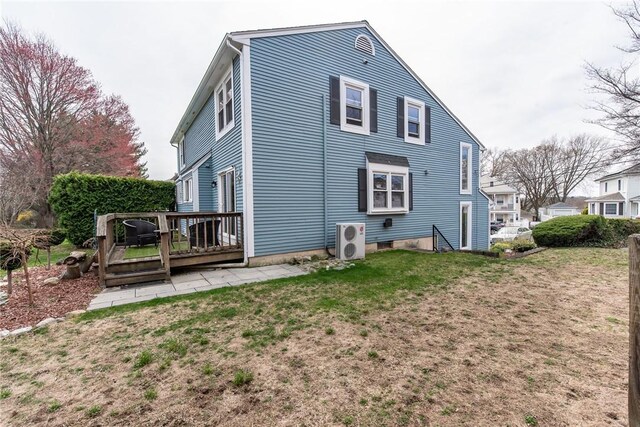 83 Wyndham Ave, Providence, RI 02908 - back of house featuring a lawn, a deck, and ac unit