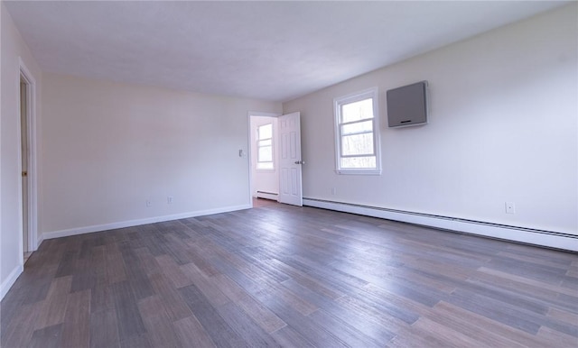 83 Wyndham Ave, Providence, RI 02908 - empty room with a baseboard radiator, wood finished floors, and baseboards