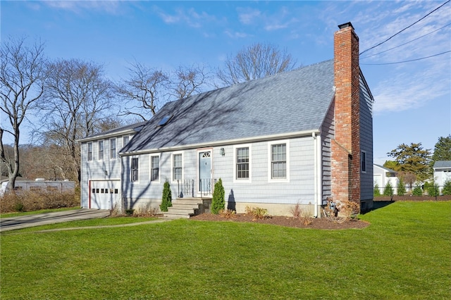 view of front facade with aphalt driveway, a front yard, fence, a chimney, and a garage