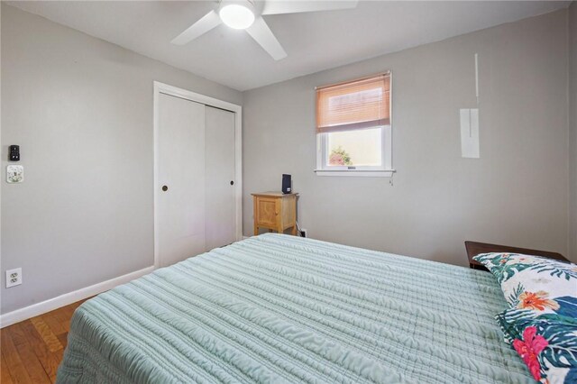 133 Old Pine Rd, Narragansett, RI 02882 - bedroom featuring wood finished floors, a closet, baseboards, and ceiling fan