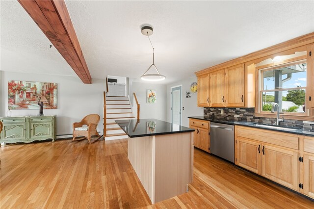 133 Old Pine Rd, Narragansett, RI 02882 - kitchen with stainless steel dishwasher, a sink, dark countertops, light wood-style flooring, and beam ceiling