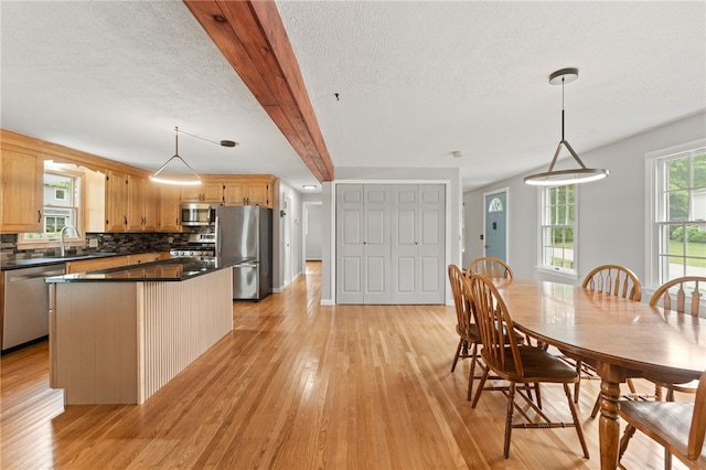 133 Old Pine Rd, Narragansett, RI 02882 - dining room with light wood-type flooring and a textured ceiling