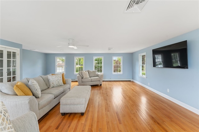 133 Old Pine Rd, Narragansett, RI 02882 - living room with baseboards, light wood-type flooring, and a ceiling fan