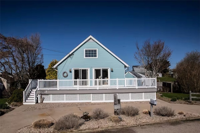back of house featuring a deck