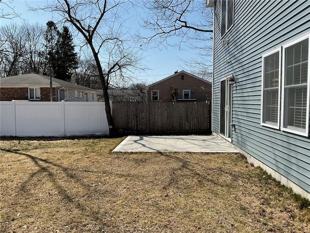 view of yard with fence and a patio area