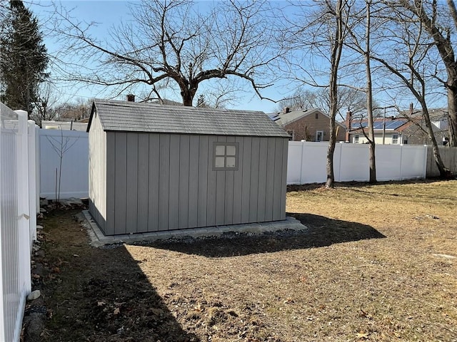 view of shed with a fenced backyard