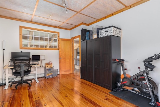 office area featuring ornamental molding and light wood finished floors