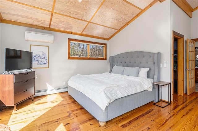 bedroom with vaulted ceiling, wood finished floors, a baseboard radiator, and an AC wall unit