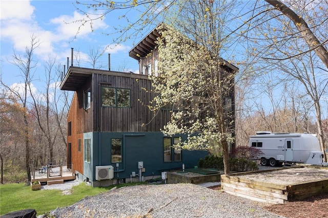 view of side of home featuring a deck