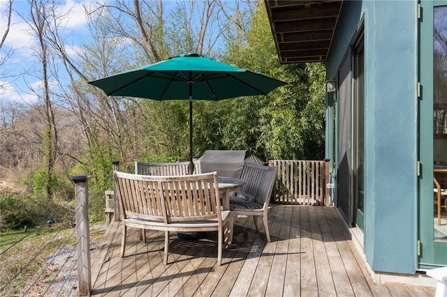 wooden deck with outdoor dining area