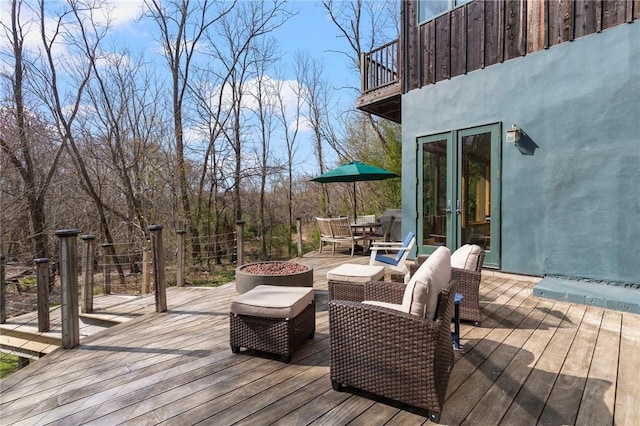 deck featuring french doors and outdoor dining area