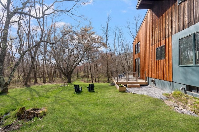view of yard featuring a wooden deck