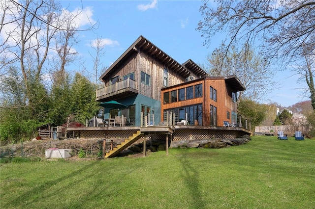 back of house with a deck, a yard, stairway, and a balcony