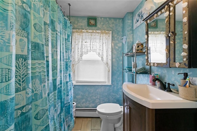 77 Seamans St, Providence, RI 02908 - bathroom featuring toilet, wallpapered walls, a baseboard heating unit, and a wealth of natural light