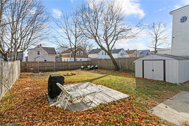 77 Seamans St, Providence, RI 02908 - view of yard with an outbuilding, a fenced backyard, a storage shed, and a residential view