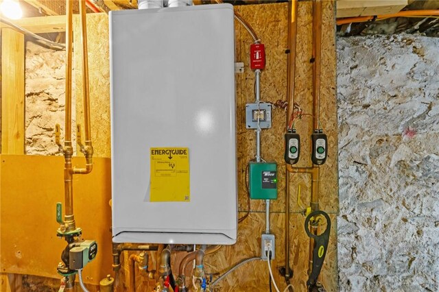 77 Seamans St, Providence, RI 02908 - utility room with tankless water heater