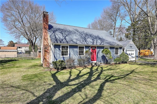 view of front of house with entry steps, a chimney, fence, and a front lawn