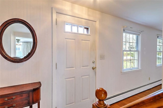 foyer entrance with a baseboard radiator