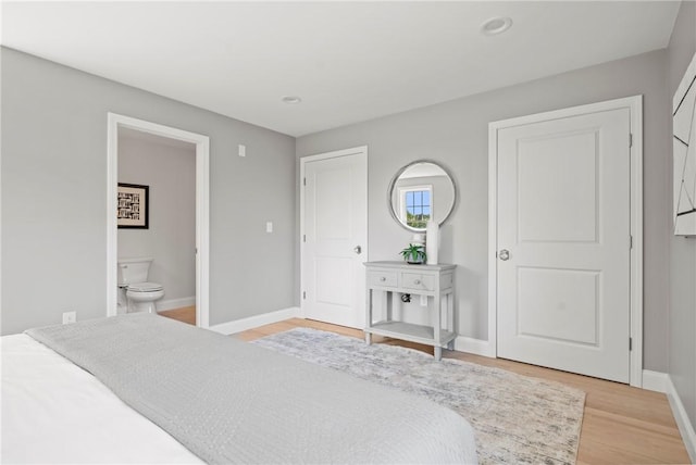 0 Greenwich Blvd Unit 102, East Greenwich, RI 02818 - bedroom featuring light wood finished floors, baseboards, ensuite bathroom, and recessed lighting