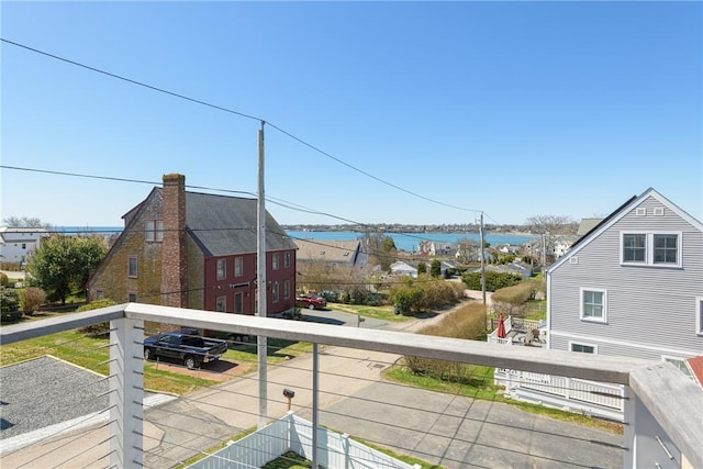 balcony featuring a water view
