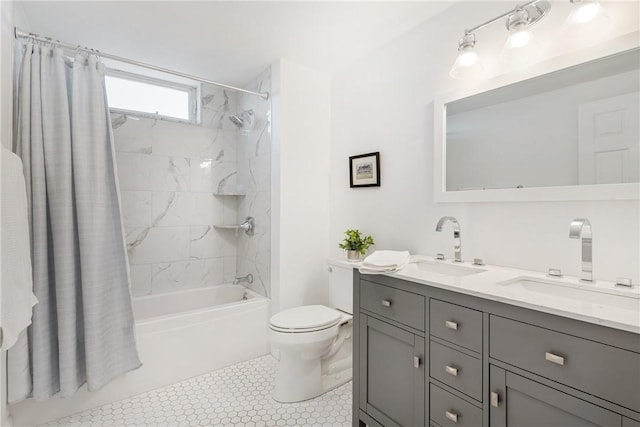 bathroom featuring double vanity, shower / tub combo with curtain, toilet, and a sink