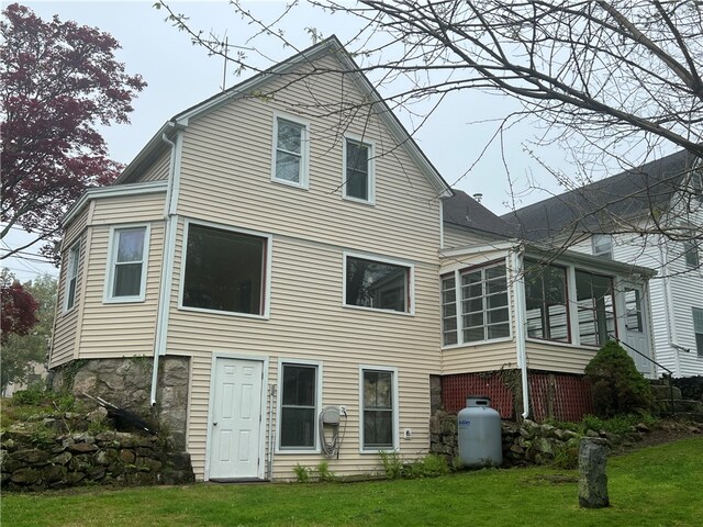 196 Columbia St, South Kingstown, RI 02879 - rear view of property with a yard and a sunroom