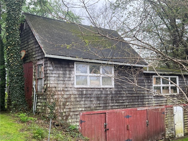 196 Columbia St, South Kingstown, RI 02879 - view of side of home featuring roof with shingles