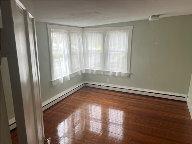 196 Columbia St, South Kingstown, RI 02879 - spare room featuring baseboards, baseboard heating, and hardwood / wood-style flooring