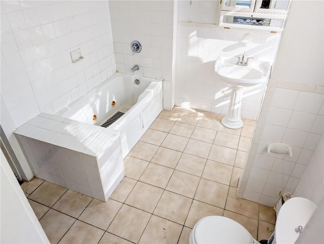 17 Marietta St, Providence, RI 02904 - full bathroom with toilet, tile patterned floors, a tub with jets, and tile walls