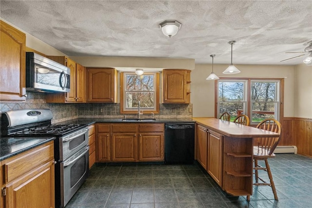 kitchen featuring plenty of natural light, a sink, open shelves, and appliances with stainless steel finishes