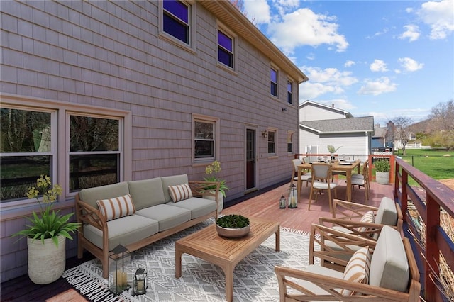 deck featuring an outdoor living space and outdoor dining area