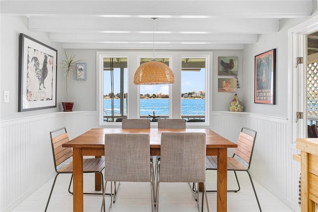 1597 Main Rd, Tiverton, RI 02878 - dining space with beamed ceiling, a wealth of natural light, a wainscoted wall, and a water view