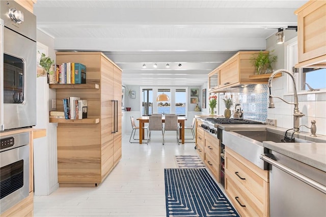 1597 Main Rd, Tiverton, RI 02878 - kitchen featuring light brown cabinetry, beamed ceiling, light wood-style floors, and appliances with stainless steel finishes