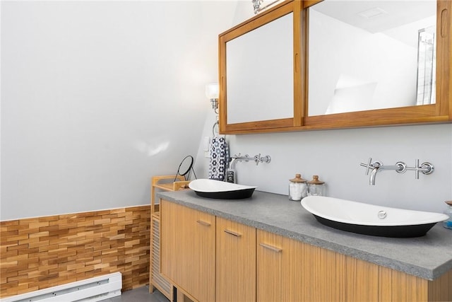 1597 Main Rd, Tiverton, RI 02878 - bathroom featuring double vanity, a sink, and a baseboard radiator