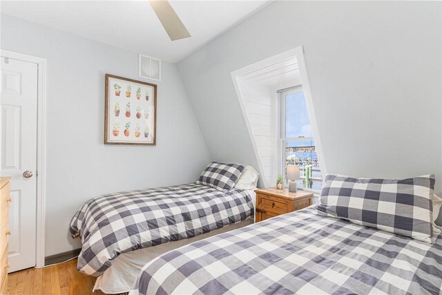 1597 Main Rd, Tiverton, RI 02878 - bedroom featuring wood finished floors, visible vents, and ceiling fan