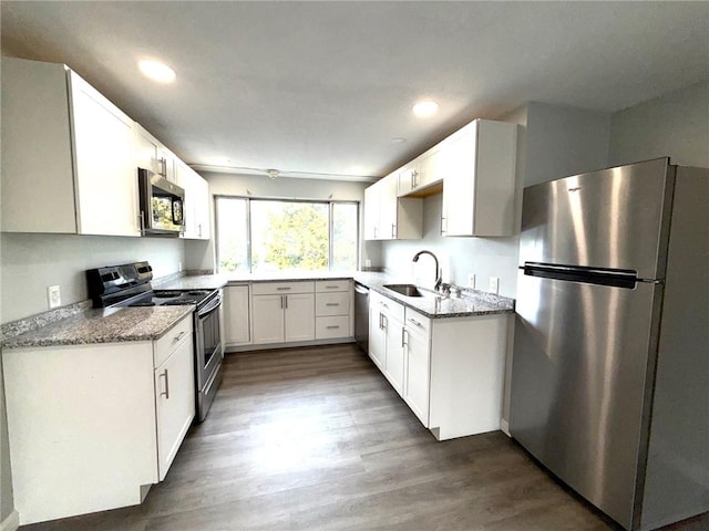 53 Urban Ave Unit 6, North Providence, RI 02904 - kitchen with a sink, dark wood finished floors, recessed lighting, and stainless steel appliances