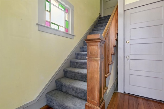 staircase with wood finished floors