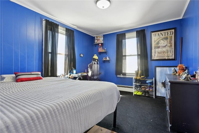 bedroom with a baseboard radiator, ornamental molding, and multiple windows