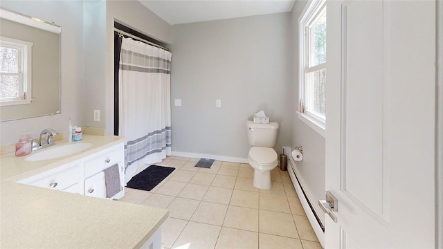 full bath featuring baseboards, toilet, a baseboard radiator, vanity, and tile patterned flooring