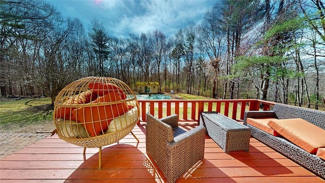 wooden terrace with an outdoor hangout area