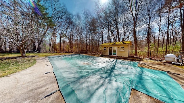 view of pool featuring a storage structure, a fenced in pool, fence, and an outdoor structure