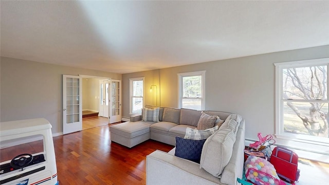 living room featuring french doors and wood finished floors