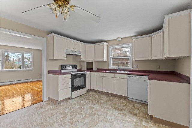 345 Post Rd, Warwick, RI 02888 - kitchen featuring under cabinet range hood, dishwasher, a baseboard radiator, a sink, and electric range oven