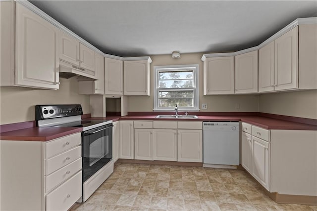 345 Post Rd, Warwick, RI 02888 - kitchen with under cabinet range hood, a sink, dark countertops, white dishwasher, and range with electric cooktop
