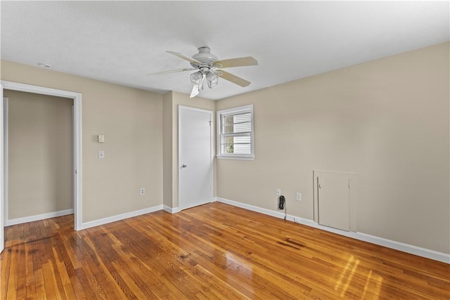 345 Post Rd, Warwick, RI 02888 - empty room with wood finished floors, ceiling fan, and baseboards