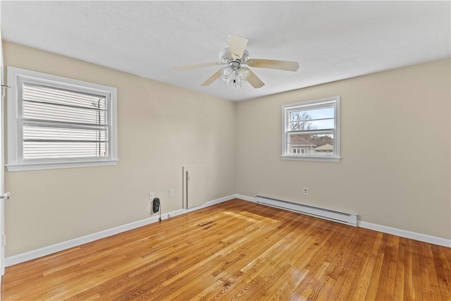 345 Post Rd, Warwick, RI 02888 - unfurnished room with light wood finished floors, a baseboard heating unit, baseboards, and ceiling fan