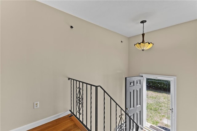 345 Post Rd, Warwick, RI 02888 - stairway featuring wood finished floors and baseboards