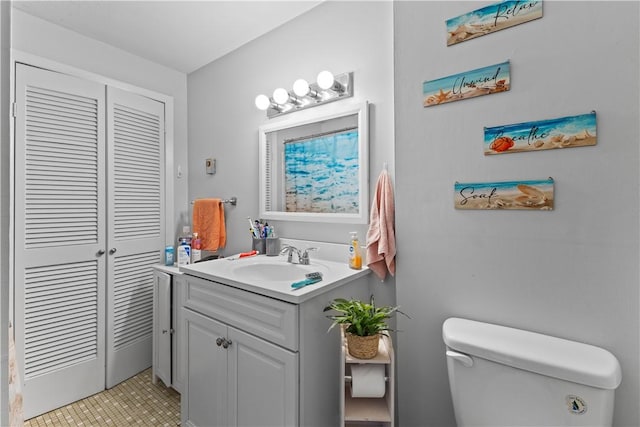 345 Post Rd, Warwick, RI 02888 - bathroom featuring toilet, a closet, and vanity