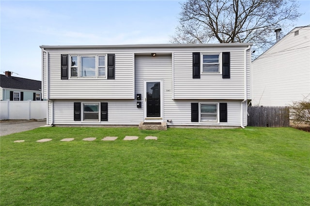 345 Post Rd, Warwick, RI 02888 - raised ranch featuring a front yard and fence